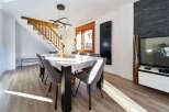 Stunning dining area with modern table and chairs, bathed in natural sunlight.