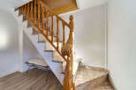 This stunning property boasts a grand staircase with exquisite wooden banisters and granite steps, adding a touch of elegance to the home.