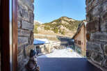 Mountain view from a charming stone house.