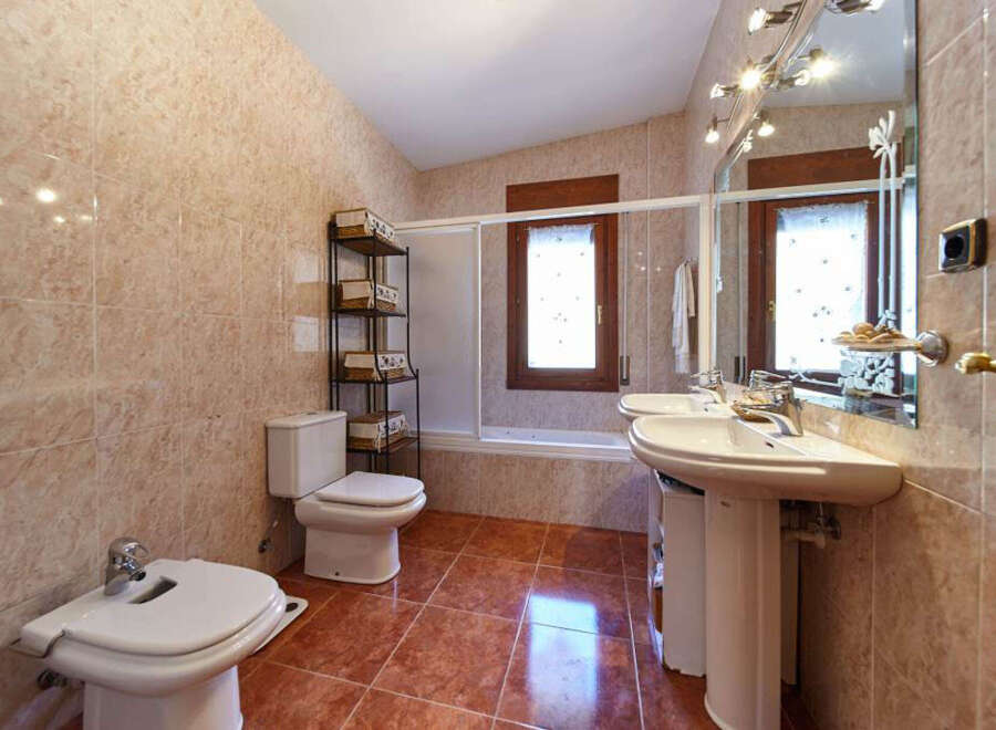 This stunning bathroom boasts a spacious layout with modern fixtures and finishes.