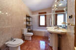 This stunning bathroom boasts a spacious layout with modern fixtures and finishes.