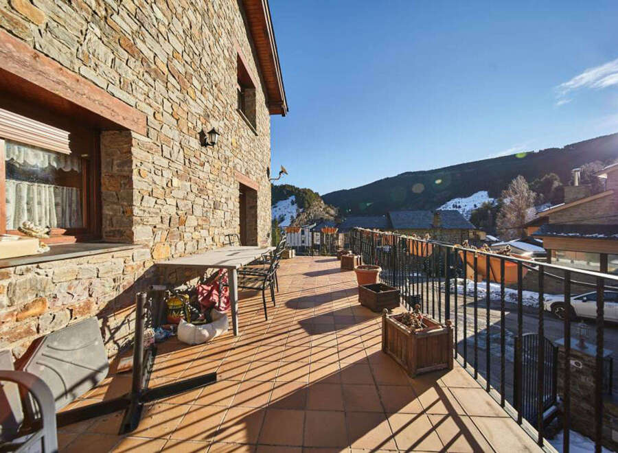 This stunning property boasts a spacious balcony with breathtaking mountain views, perfect for enjoying the crisp mountain air.