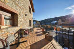 This stunning property boasts a spacious balcony with breathtaking mountain views, perfect for enjoying the crisp mountain air.