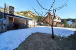 Mountain chalet with stunning views and outdoor BBQ area.