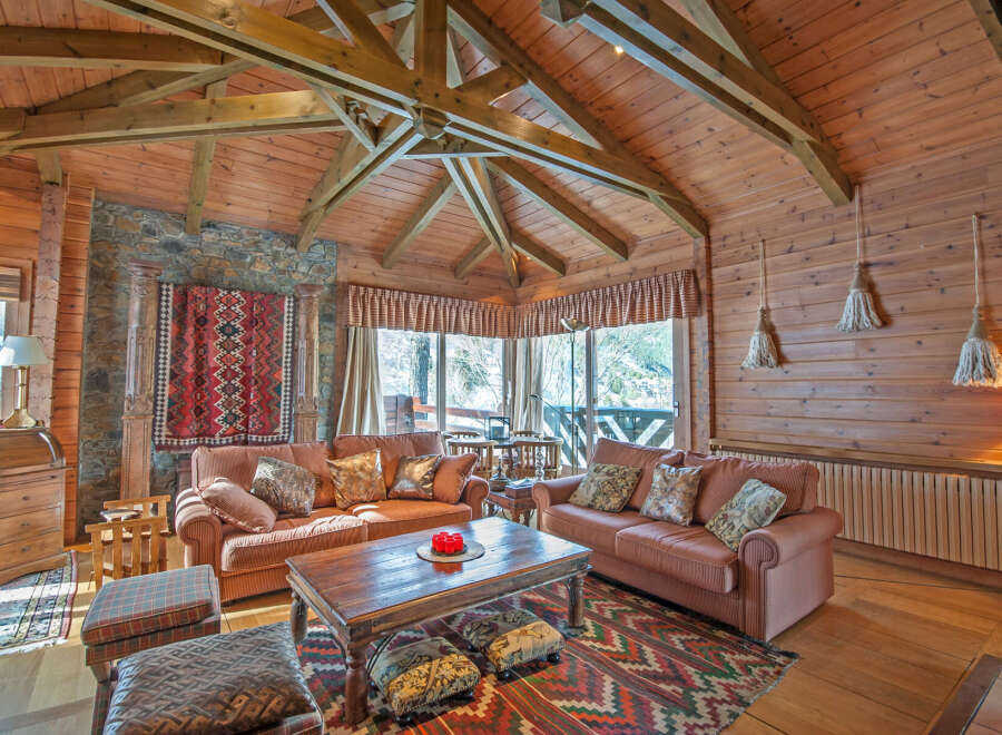 Cozy up in this stunning log cabin with a breathtaking view.