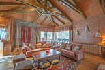 Cozy up in this stunning log cabin with a breathtaking view.