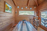 Cozy wooden cabin with stunning mountain views.