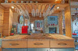 This stunning log cabin boasts a gourmet kitchen with granite countertops and custom cabinetry.
