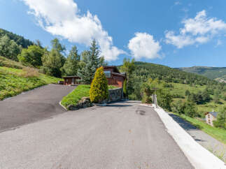 Mountain chalet with stunning views and private driveway.