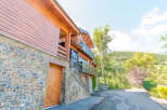 This stunning chalet boasts a unique blend of wood and stone, creating a cozy yet modern aesthetic.