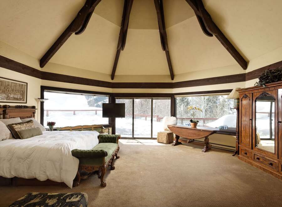 Luxurious mountaintop bedroom with stunning views.