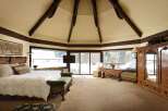 Luxurious mountaintop bedroom with stunning views.
