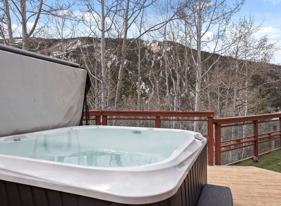 Luxury hot tub with mountain views.