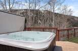 Luxury hot tub with mountain views.
