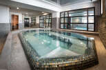 This luxurious spa boasts a stunning indoor hot tub, perfect for relaxation and rejuvenation.