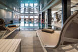 Relax and unwind in our luxurious indoor pool area, complete with comfortable loungers and a tranquil atmosphere.