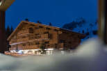 Nestled in a snowy mountainside, this stunning chalet-style hotel offers breathtaking views.
