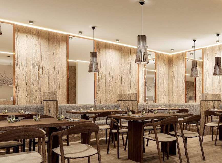 Experience fine dining in our elegant restaurant, featuring a warm and inviting atmosphere with natural wood accents and stylish pendant lighting.