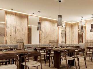 Experience fine dining in our elegant restaurant, featuring a warm and inviting atmosphere with natural wood accents and stylish pendant lighting.