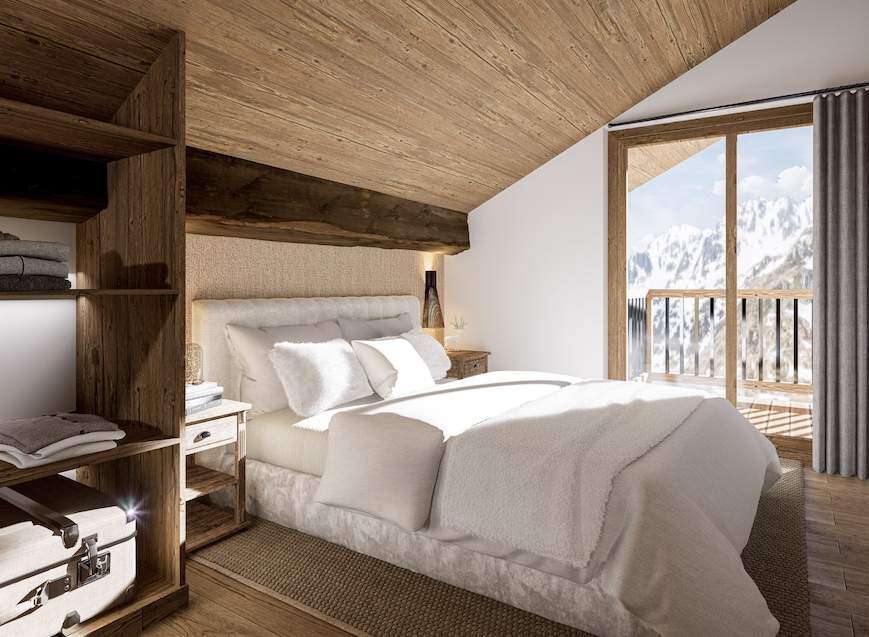 Cozy chalet bedroom with wooden accents and mountain views.
