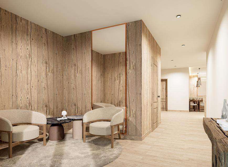 Relax in style in this serene waiting area, featuring a calming wood design and plush seating.