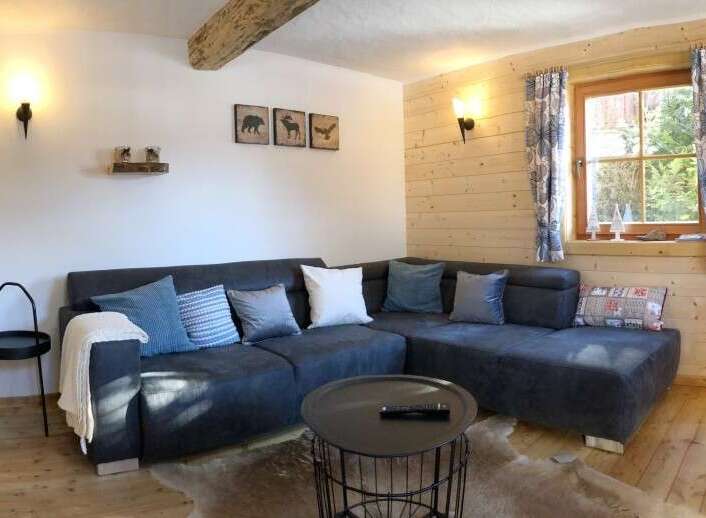 This cozy living space features a comfortable sectional sofa, perfect for relaxing after a long day.