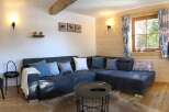 This cozy living space features a comfortable sectional sofa, perfect for relaxing after a long day.