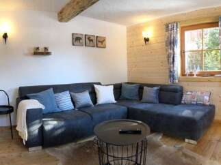 This cozy living space features a comfortable sectional sofa, perfect for relaxing after a long day.