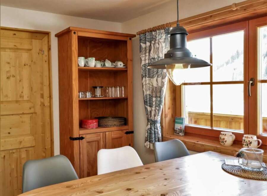 This charming property boasts a cozy dining area, perfect for enjoying meals with loved ones.