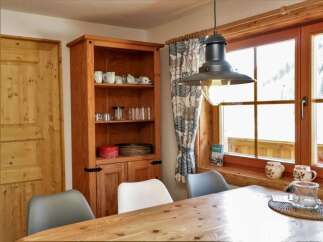 This charming property boasts a cozy dining area, perfect for enjoying meals with loved ones.