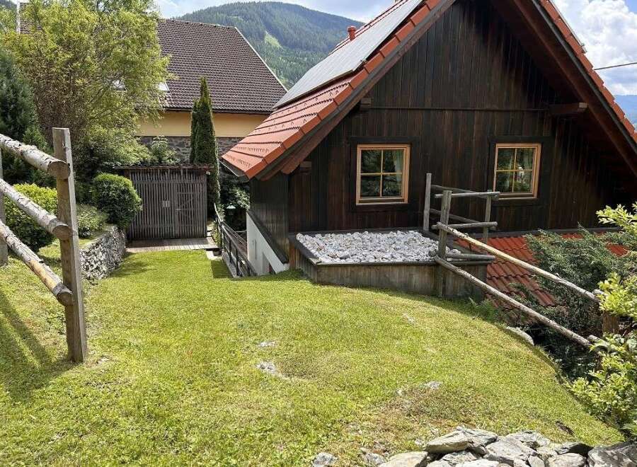 Discover a charming wooden cabin nestled in a picturesque setting, perfect for a peaceful retreat.