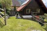 Discover a charming wooden cabin nestled in a picturesque setting, perfect for a peaceful retreat.