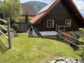 Discover a charming wooden cabin nestled in a picturesque setting, perfect for a peaceful retreat.