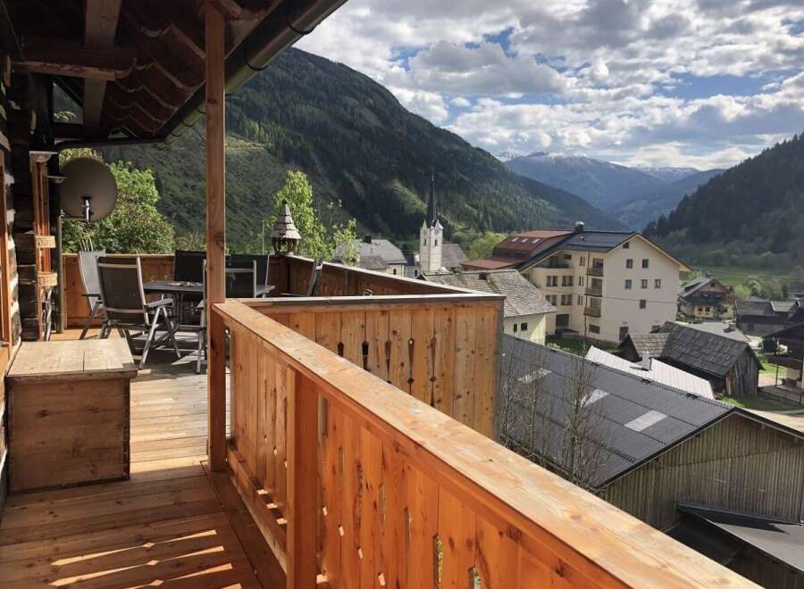 Enjoy breathtaking mountain views from this charming balcony.