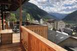 Enjoy breathtaking mountain views from this charming balcony.