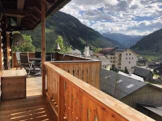 Enjoy breathtaking mountain views from this charming balcony.
