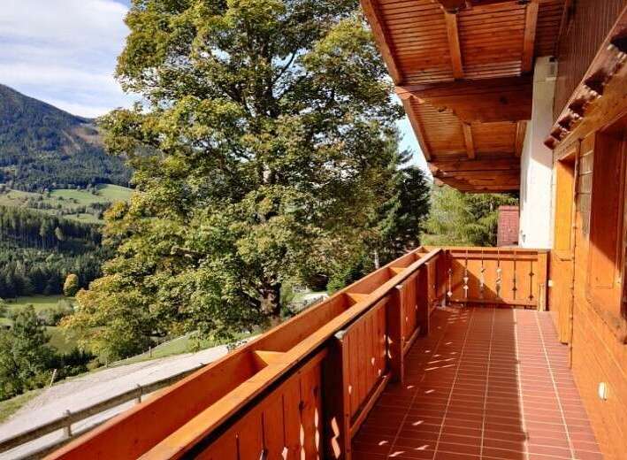Enjoy breathtaking mountain views from this charming balcony.