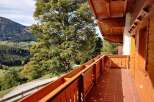 Enjoy breathtaking mountain views from this charming balcony.