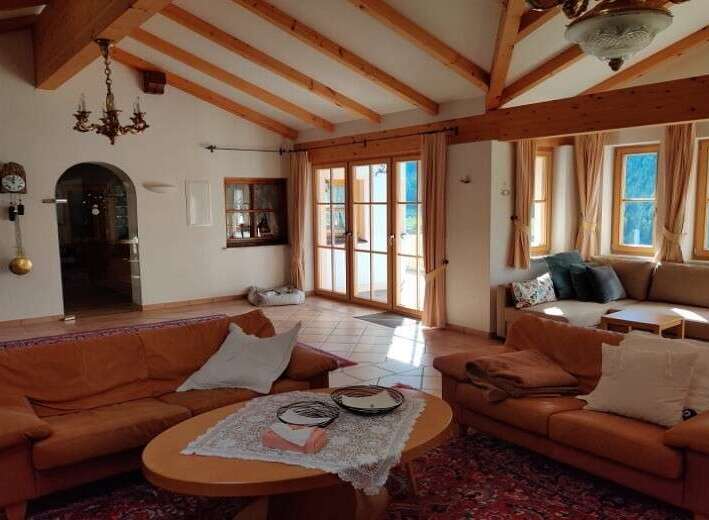 Experience the charm of this inviting living space, featuring a cozy seating area and a warm, inviting atmosphere.