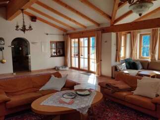 Experience the charm of this inviting living space, featuring a cozy seating area and a warm, inviting atmosphere.