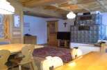 Experience the charm of this cozy property, featuring a traditional wooden interior and a unique tiled stove.