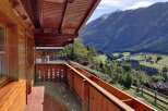 Enjoy breathtaking mountain views from this charming balcony.