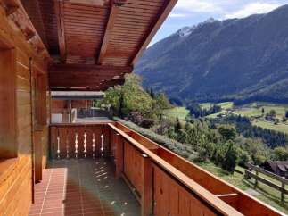 Enjoy breathtaking mountain views from this charming balcony.