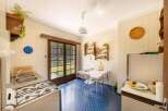 Step back in time in this charming vintage kitchen, featuring retro appliances and a delightful blue tiled floor.