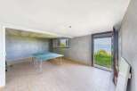 This property boasts a spacious basement game room, perfect for recreation and leisure.
