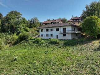 Nestled on a spacious lot, this charming house offers serene views and ample outdoor space.