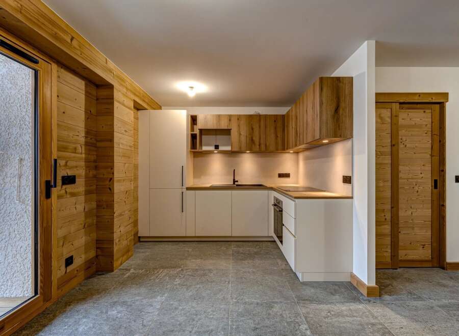 This stunning kitchen boasts a modern design with a touch of rustic charm.