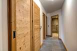 This stunning hallway showcases exquisite wooden doors and a modern design.