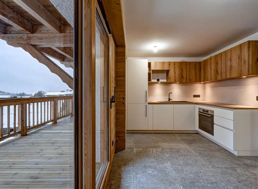 Experience the perfect blend of modern design and rustic charm in this stunning kitchen.