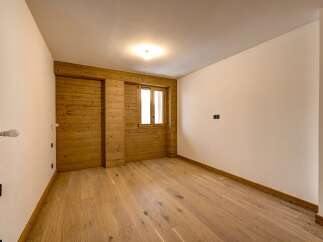 Discover the charm of this inviting space, featuring warm wooden accents and a bright, airy atmosphere.